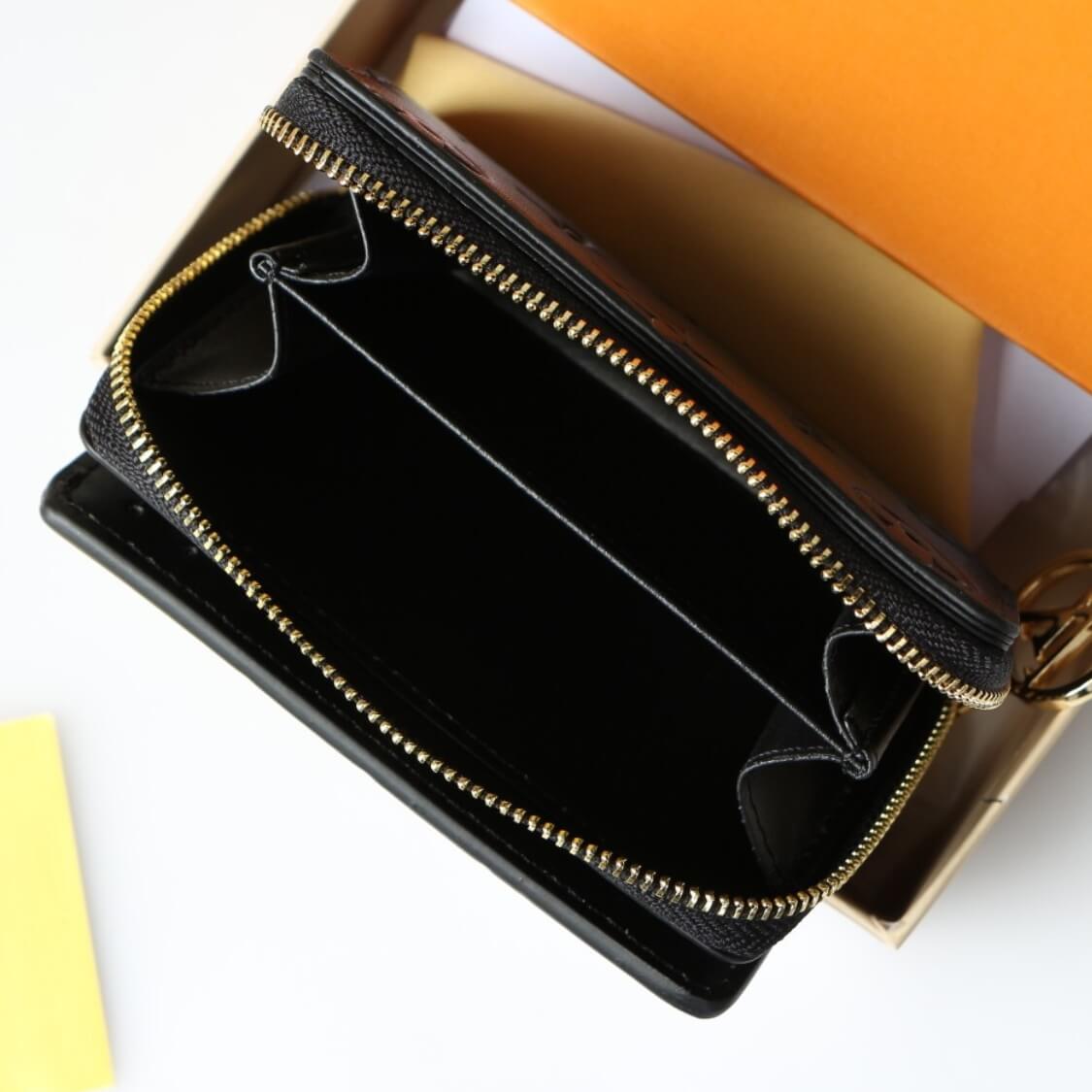 Small Embossed Zip Around Wallet In Black