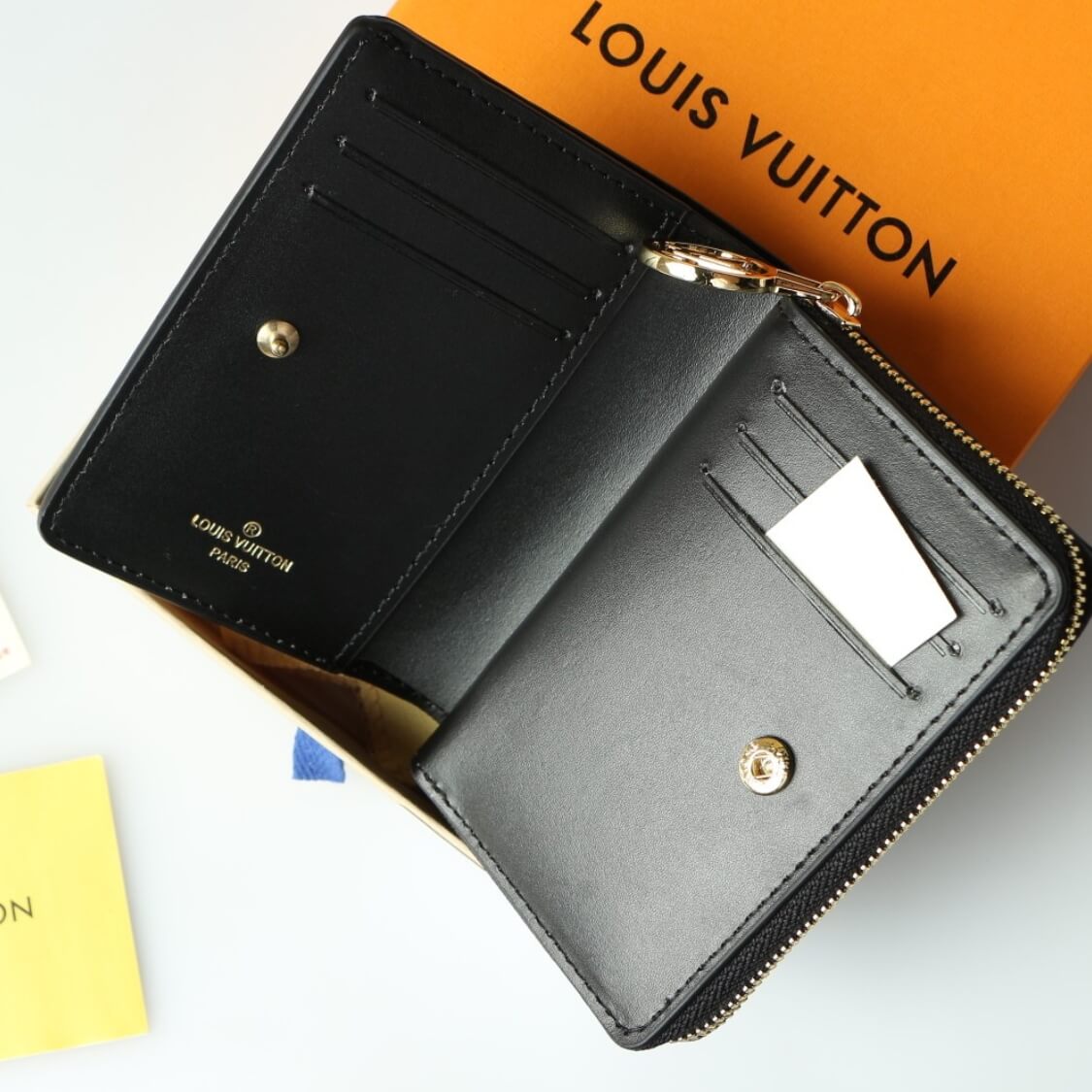 Small Embossed Zip Around Wallet In Black